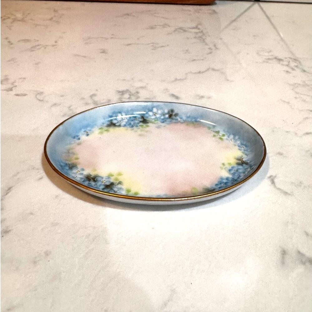 vintage hand-painted porcelain trinket dish blue floral motifs subtle gold trim